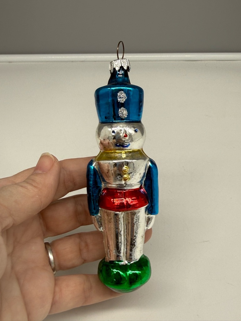 Vintage blown-glass toy soldier nutcracker ornament.
